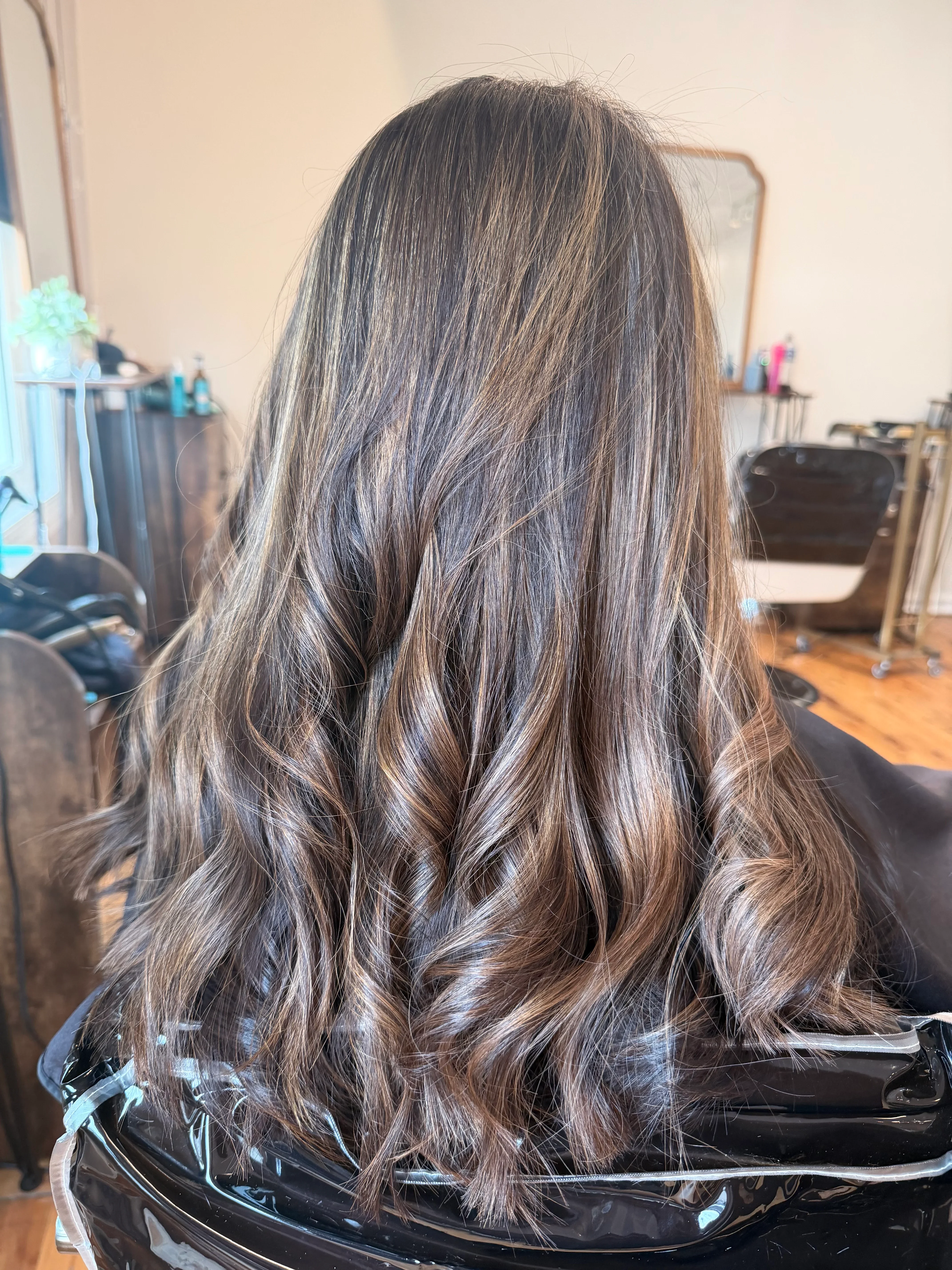 Lived-in dimensional hair color created at Glow Salon & Spa