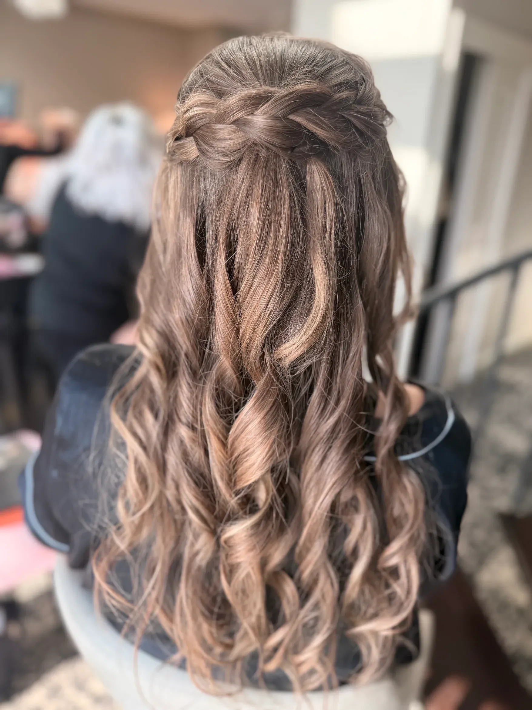 Half-up bridal hairstyle with soft waves by Glow Salon & Spa in Carmel, Indiana